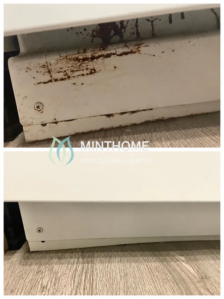 Along the appliance base — Visible residue on an accessible exterior panel.