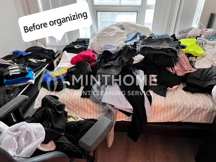 Before organizing — Clothing laid out before sorting and putting away. Organizing is arranged separately.